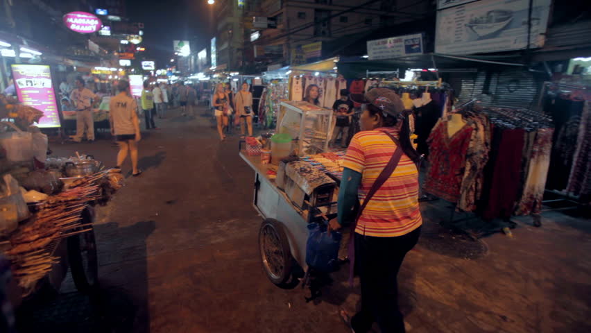 BANGKOK - NOV 20: Food vendors on Khao San Road at night on 20 November 2012 in Bangkok, Thailand. Khao San road is the mekka for all tourists arriving in the capital.