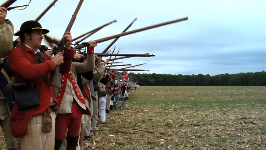 VIRGINIA - OCTOBER 2009 - large-scale, epic American Revolutionary War anniversary reenactment -- in the middle of battle.  Continental Army infantry volleys and fires in line of battle - Militia.