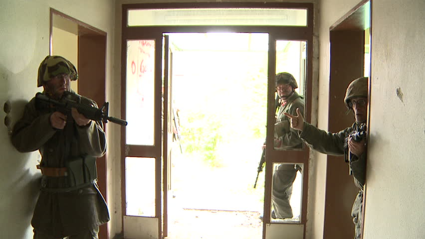 Soldiers entering building, slow motion shot