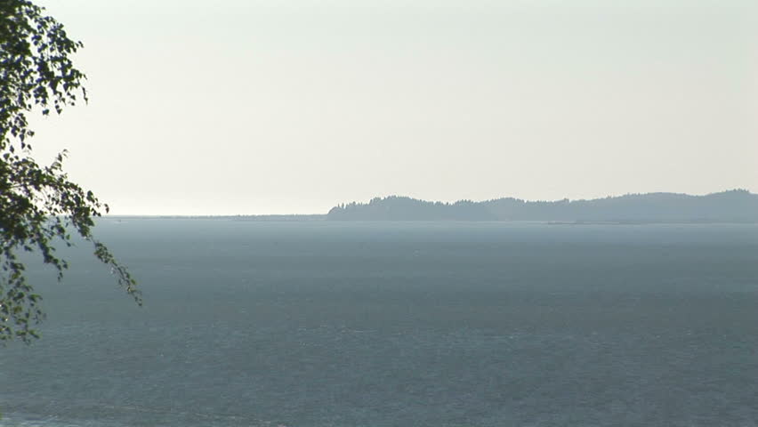 Back zoom  of the Columbia river to full view of Astoria bridge, OR