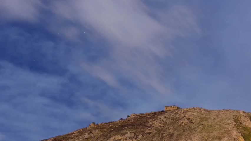 Mountain with castle on the top time laps