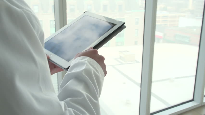 Doctor on his tablet