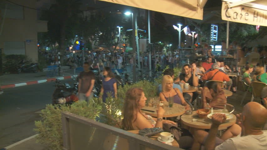 Tel Aviv - CIRCA 2011: People enjoying night life at Caffe in Rothschild Boulevard, Israel