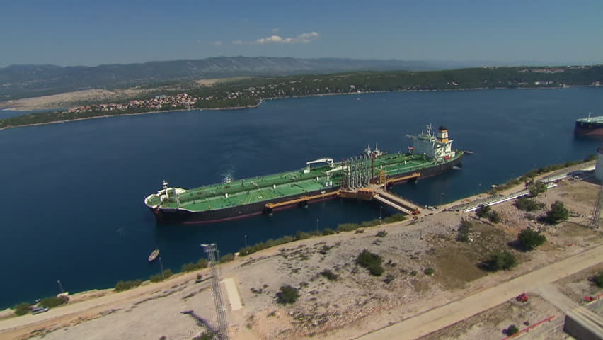 Aerial shot of two tanker boats anchored in LNG terminal