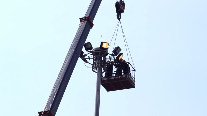 Worker repair superhighway lighting column