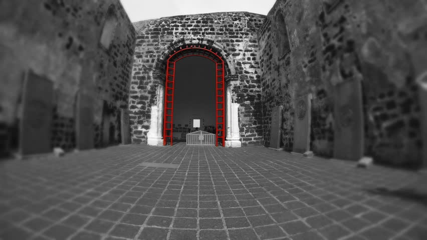 MALACCA 26 March: (color graded) panning time lapse with tilt shift effect of tourist looking at the tombstones in   st Paul church in Malacca Malaysia 26th March 2013