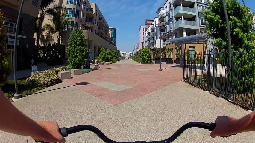 LONG BEACH, CA - APRIL 2, 2013: The POV of someone riding a bicycle on The Promenade circa 2013 in downtown Long Beach. Long Beach promotes bike riding and being a bicycle friendly city.