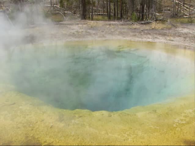 Damp rising from Morning Glory Pool. The hot springs in Yellowstone National Park have the most fantastic colours are caused by sulphur, manganese, iron and all kinds of organisms.