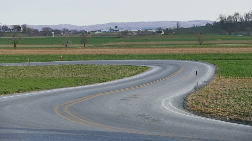 INTERCOURSE,PENNSYLVANIA - APRIL 7 : An Amish family travels with horse and carriage on April 7, 2013 in Intercourse,Lancaster County,Pennsylvania.