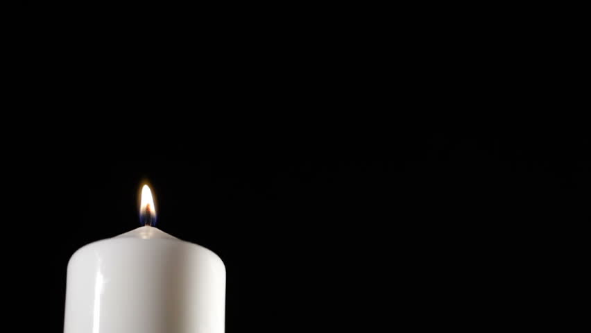 Extinguished candle with beautiful dancing smoke and copy space for something.