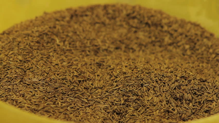 falling cumin seeds