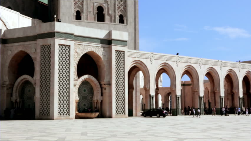 CASABLANCA, MOROCCO - OCT 16: Prayers and tourists sightseeing the exterior of the Mosque Hassan II on October 16, 2010 in Casablanca, Morocco. 