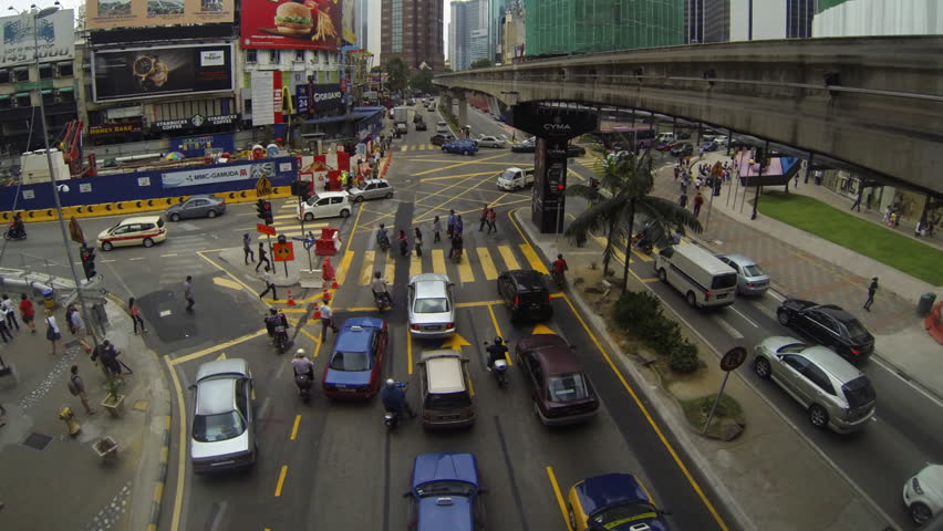 KUALA LUMPUR - MARCH 21:  panning time lapse of  traffic on Jalan Bukit Bintang in Kuala Lumpur Malaysia on 21 March 2013