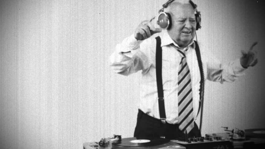 a very funky elderly grandpa dj mixing records
