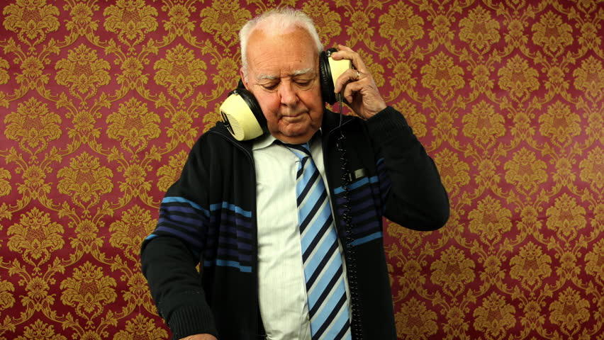 a very funky elderly grandpa dj mixing records
