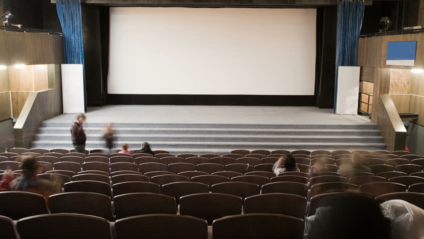 Cinema auditorium is crowding by people to watch movie performance. Ready for adding your own picture or text.