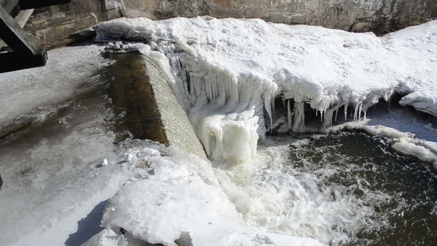 corner of river waterfall water cascade fall down and splash bubble. beautifully frozen ice and icicles.