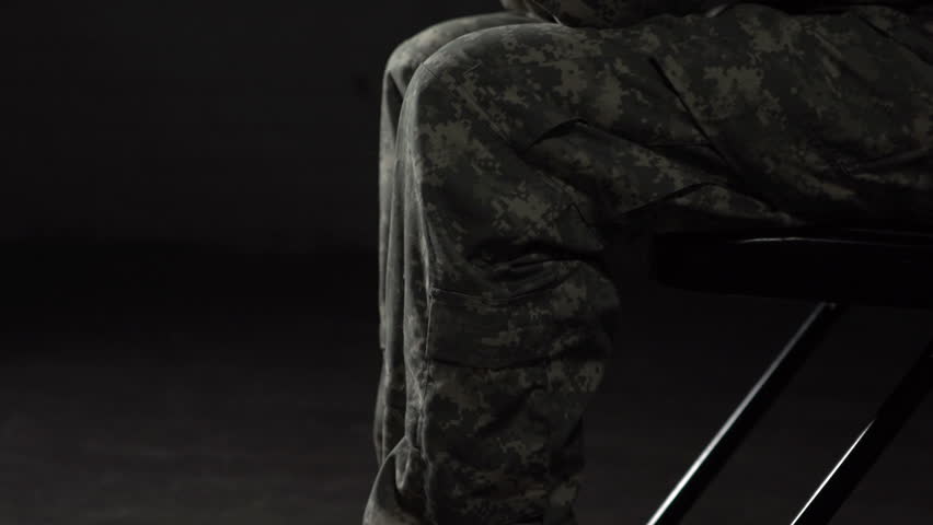 Young military woman struggling with Post Traumatic Stress Disorder