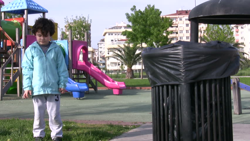 Little boy Picking Up Litter 