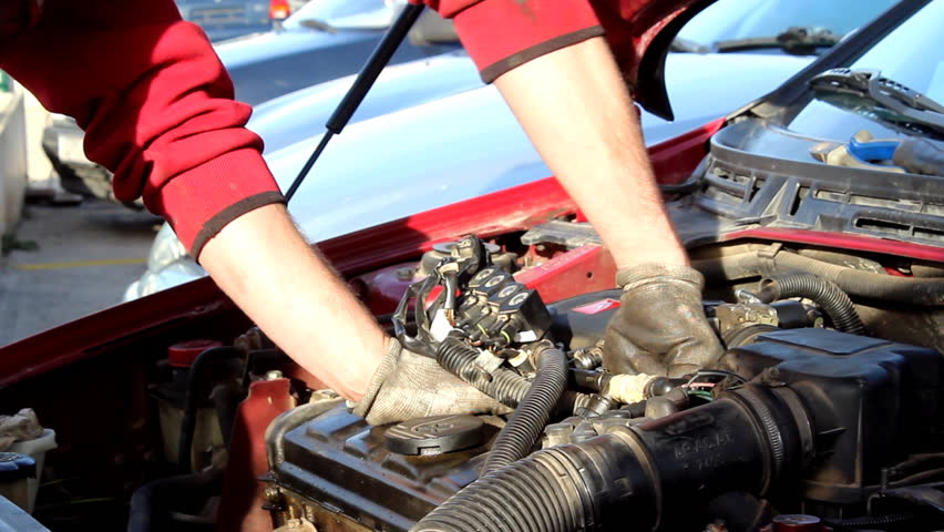 Working on the car - Mechanic working on the car.