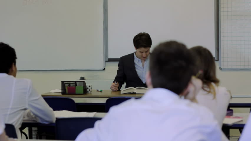 High School Classroom - Teacher addresses the class