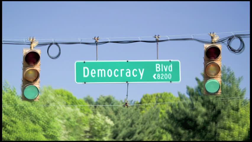 A green traffic light on Democracy Blvd symbolizing the thriving Republican Ideal of Democracy in America, Washington, DC