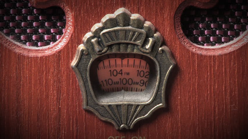 Tuning an old-fashioned radio.