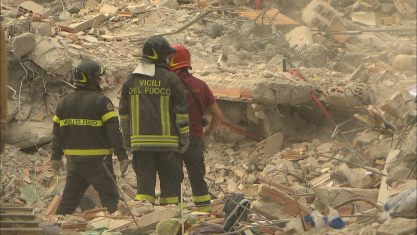 L'AQUILA, ITALY - CIRCA 2009: Recovery , construction crew uncovering rubble after the 2009 L'Aquila earthquake.