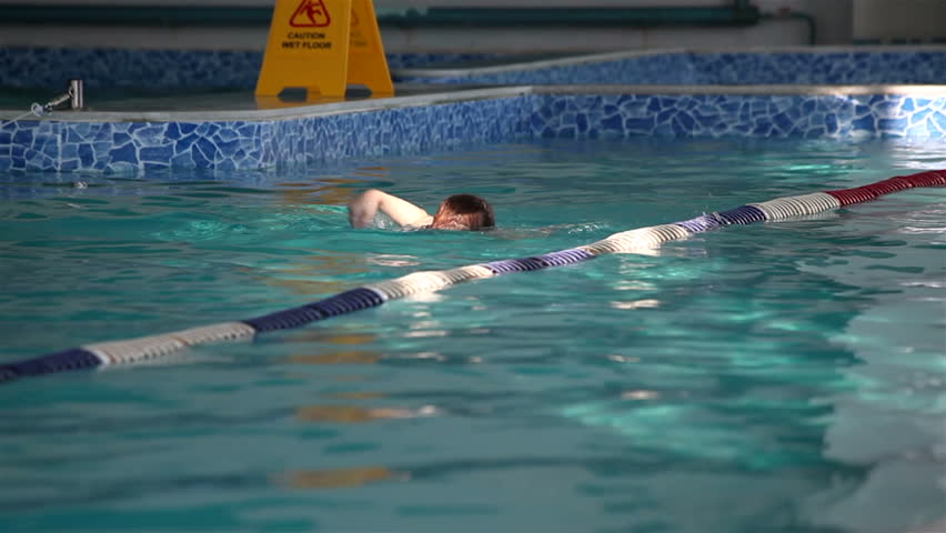 Little girl swimming in the pool.