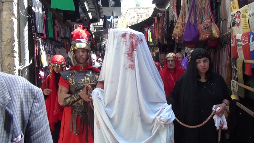 JERUSALEM-MARCH 29: Catholic Holy Friday - a group of actors depicting the crucifixion of Christ near Holy Sepulcher in Old City Jerusalem, Holy Friday March 29, 2013 in Jerusalem, Israel
