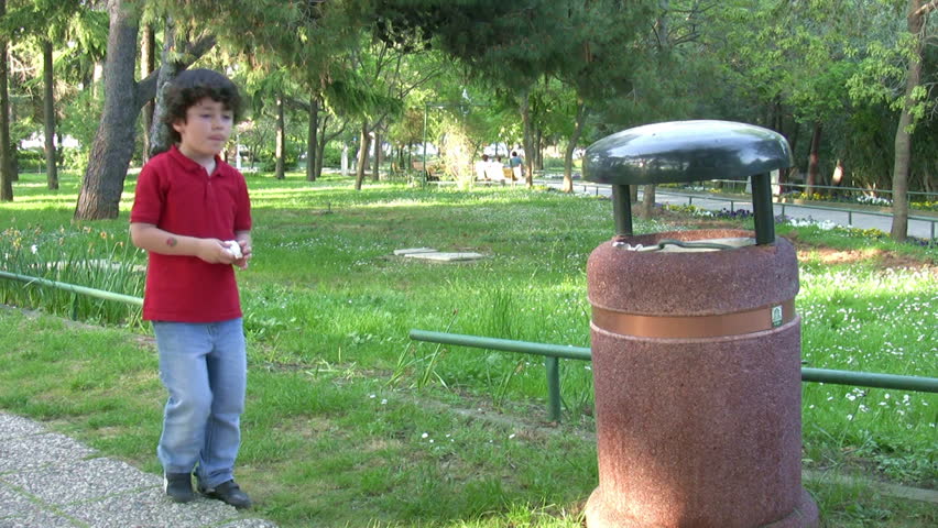 Little boy Picking Up Litter