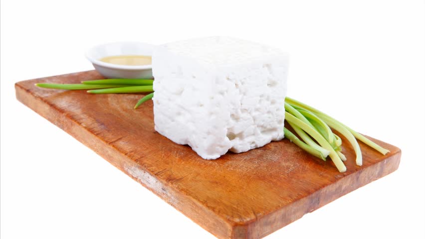 dairy food : feta white cheese cubes over small cut wooden plate 1920x1080 intro motion slow hidef hd