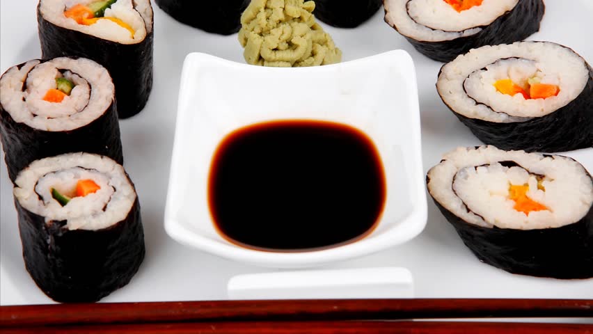 Japanese traditional Cuisine - Roll with Cucumber Cream Cheese with raw Tuna(maguro) and Salmon(sake) inside. dish with sticks 1920x1080 intro motion slow hidef hd