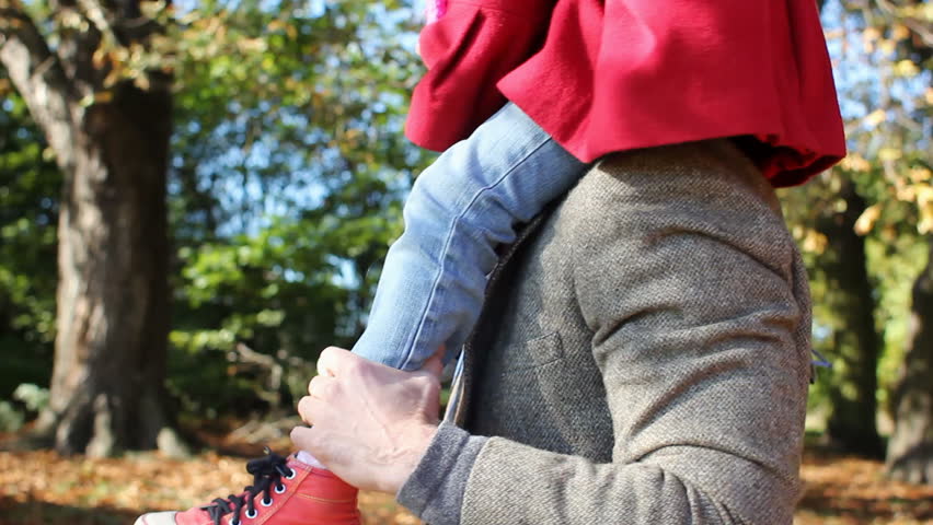 Father with daughter on shoulders - having fun