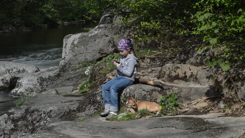 little girl playing on the tablet