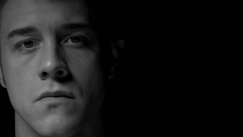 Dolly shot of man in black and white. Identical shot in color