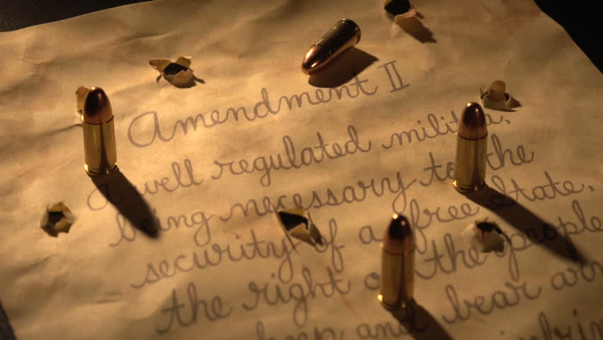 Second Amendment with bullets and bullet holes. Light shifts