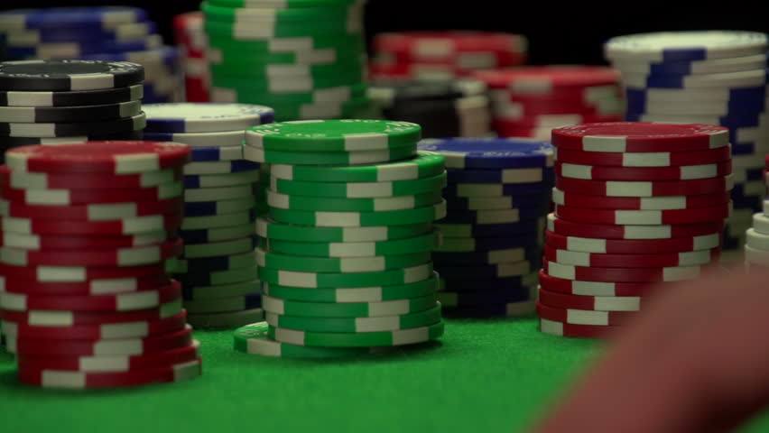 Man checks out his card in poker