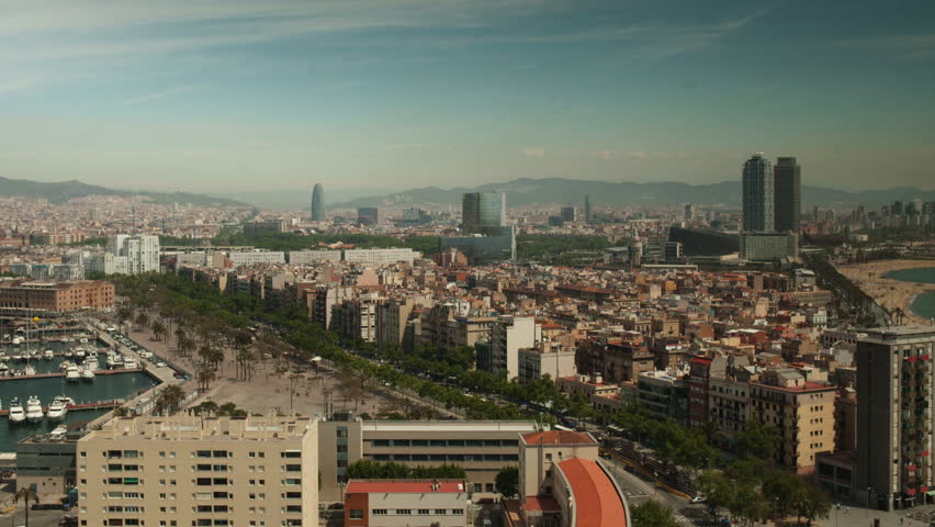 timelapse of the beautiful barcelona skyline shot from a high vantage point
