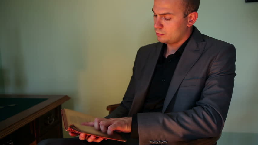 Business reading a book in an old fashioned room