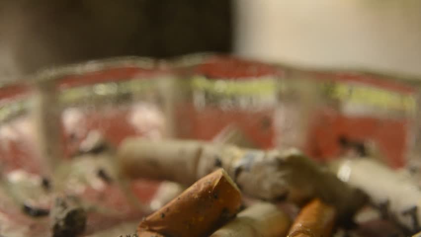 ashtray with a smoking cigarette