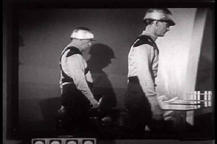 1950s - A man accidently triggers a futuristic experiment in a laboratory.