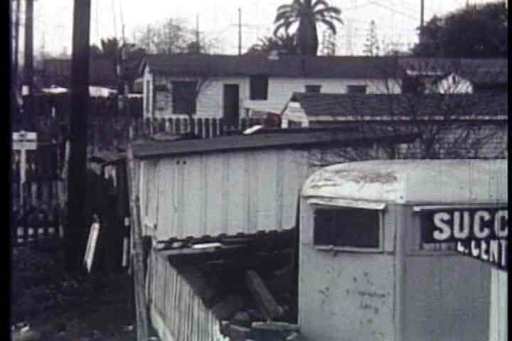 1950s - Shacks, trailers and weather beaten bungalows line the streets of Watts in 1957.
