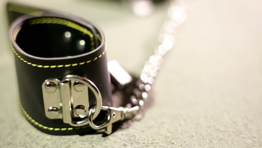BDSM or dominance and submission for short bondage cuffs for restricting persons freedom, doing with it whatever the dominant partner wants. Quality leather cuffs with locks.