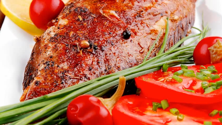 savory on wood: whole fried sunfish over plate with tomatoes lemons and peppers 1920x1080 intro motion slow hidef hd