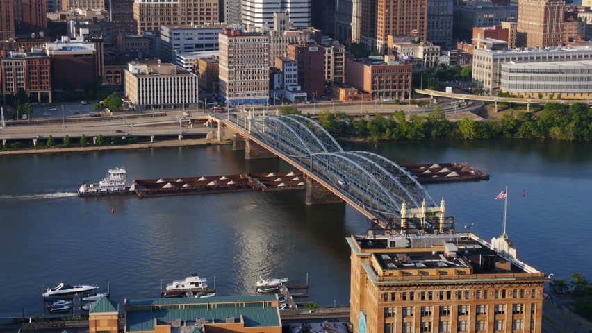 A coal barge passes under the Smithfield Street Bridge in Pittsburgh.