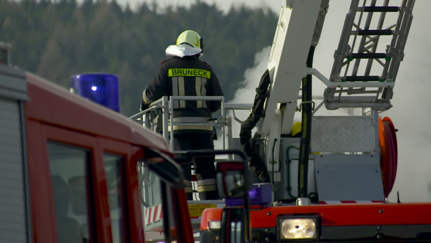 SouthTyrol, ITALY - CIRCA 2012: Fire brigade extinguish fire, garden house burns.