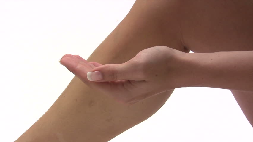 Woman Applying Body Lotion