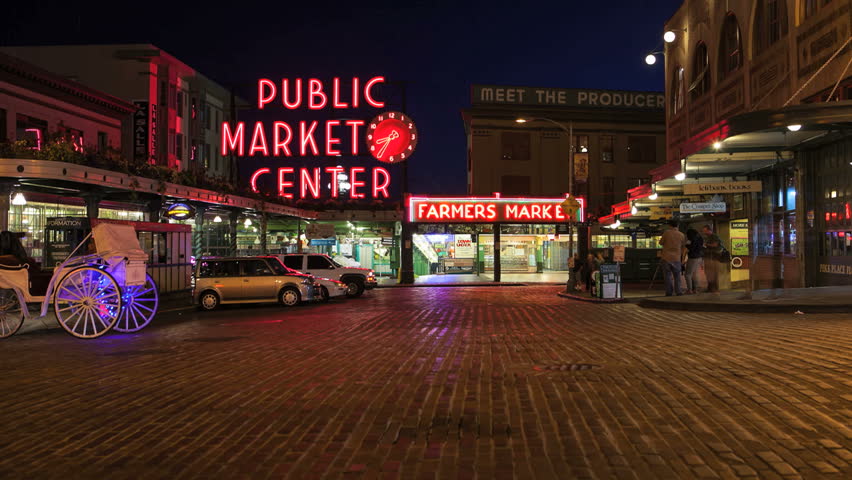 SEATTLE, WASHINGTON,  - SEPTEMBER 2: Time lapse of pedestrians and traffic at Pike Place Market at night. Pike Place Market is one of Seattle's most popular destinations. September 2, 2012