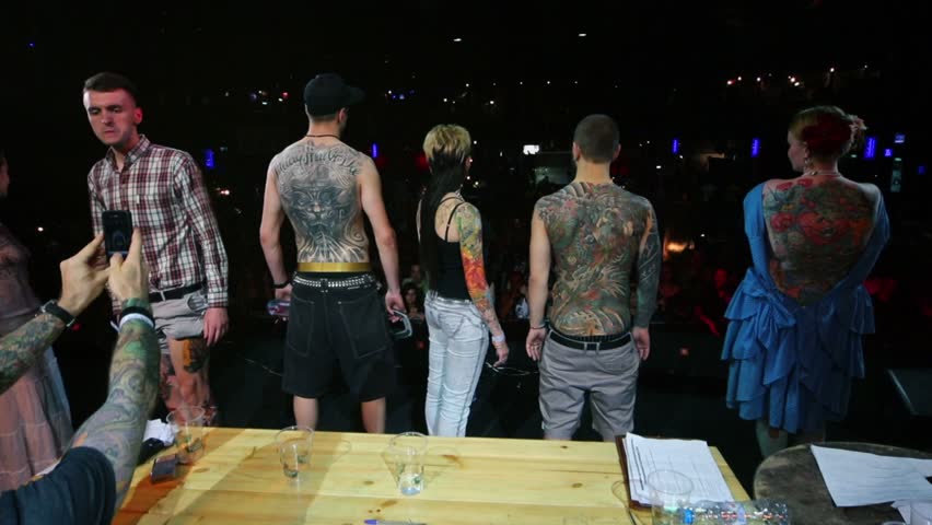 MOSCOW - MAY 20: Participants demonstrate tattoos at club ARENA during Moscow International Tattoo Convention V on May 20, 2012, Moscow, Russia. Convention was organized by Tattoo Studio Angel.
